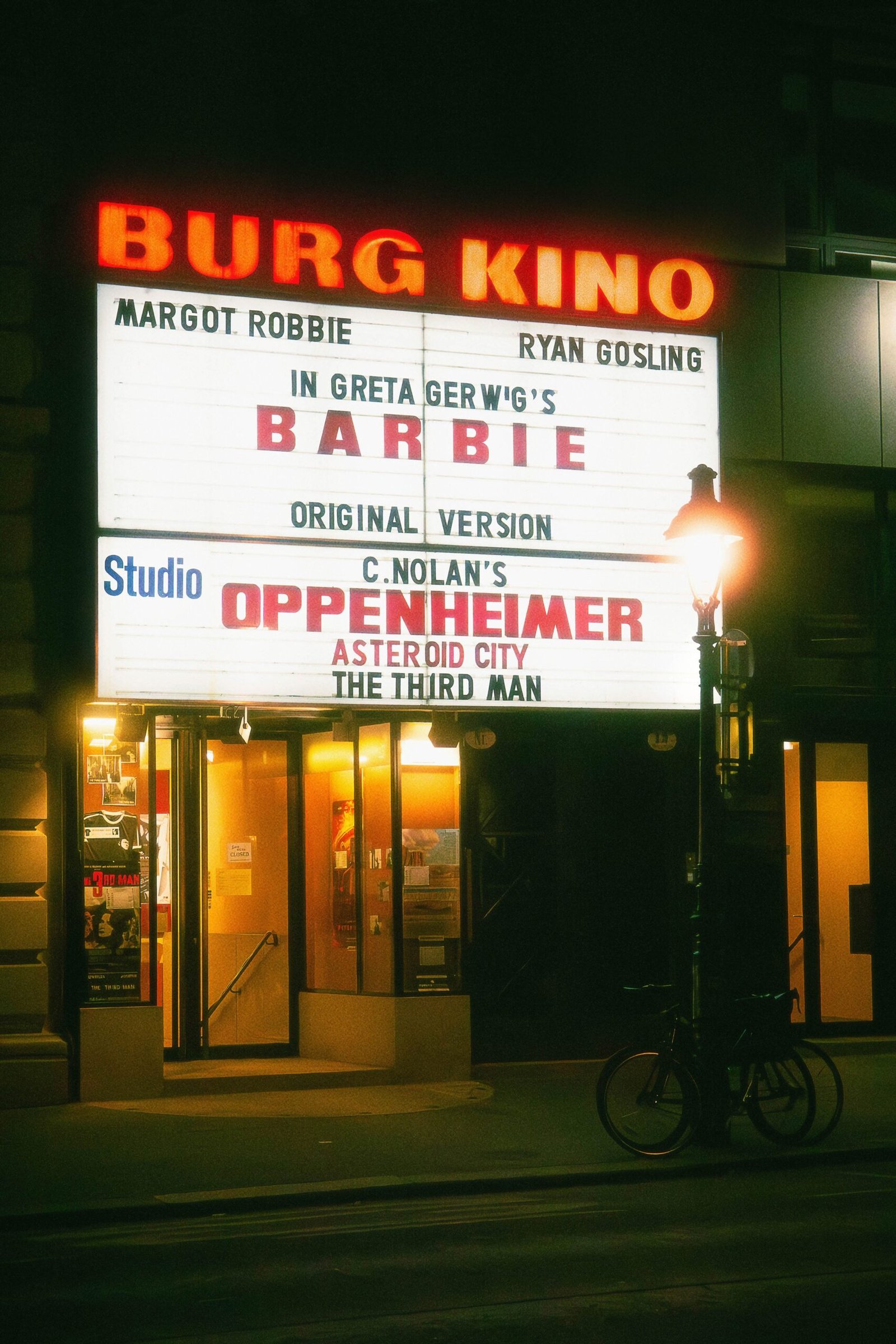 a marquee for a barber shop at night